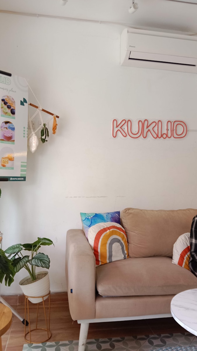 Photo by Inna Safa a living room with a couch and a table